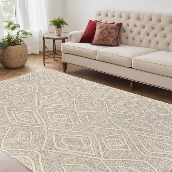 5' x 8' Wool Geometric Tufted Handmade Stain Resistant Area Rug - Tan And Ivory