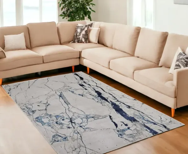 7' x 10' Marble Power Loom Distressed Area Rug - Ivory And Blue