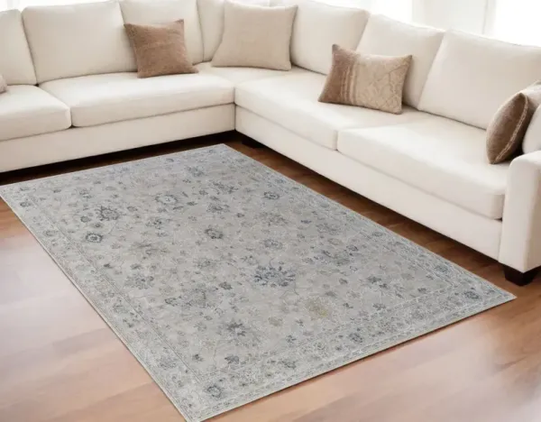 5' x 7.5' Floral Power Loom Worn Faded Area Rug With Fringe - Ivory Taupe And Blue