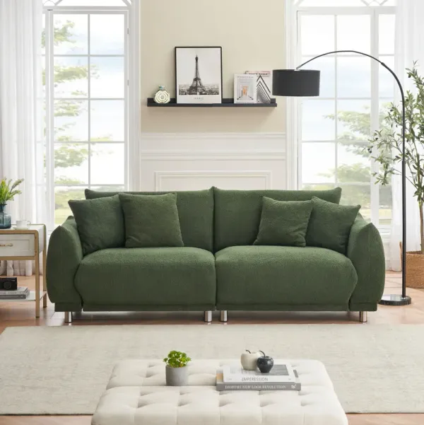 Teddy Wool Beige Sofa With Four Throw Pillows And Hardware Feet Can Sit Comfortably In An Apartment Bedroom Without Taking Up Space