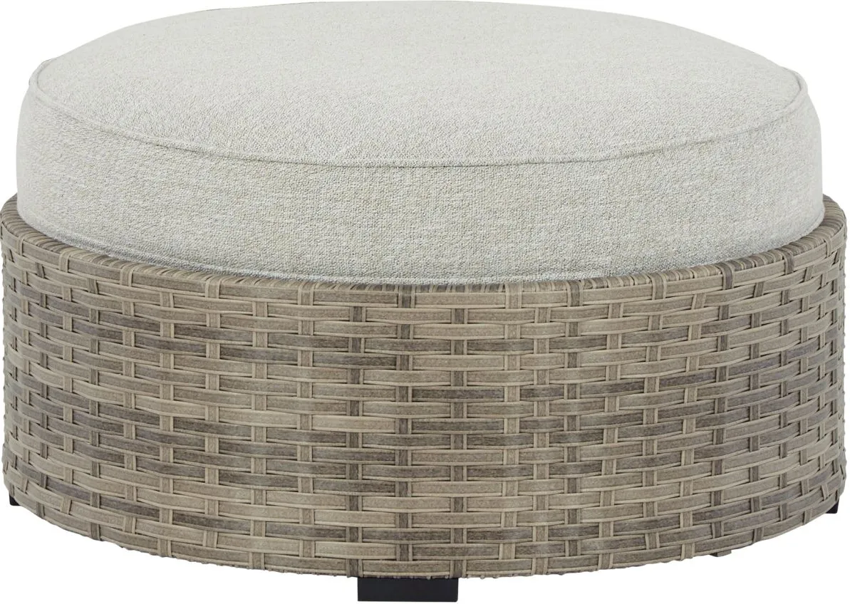 Signature Design by Ashley® Calworth Beige Outdoor Ottoman