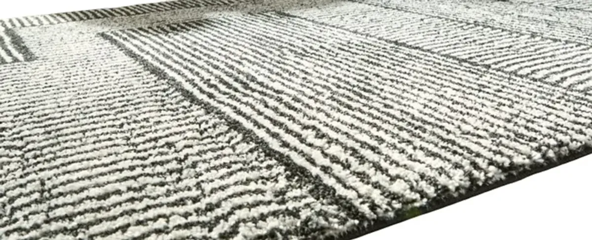 Signature Design by Ashley® Kurtmen Black/Ivory 8'x10' Area Rug