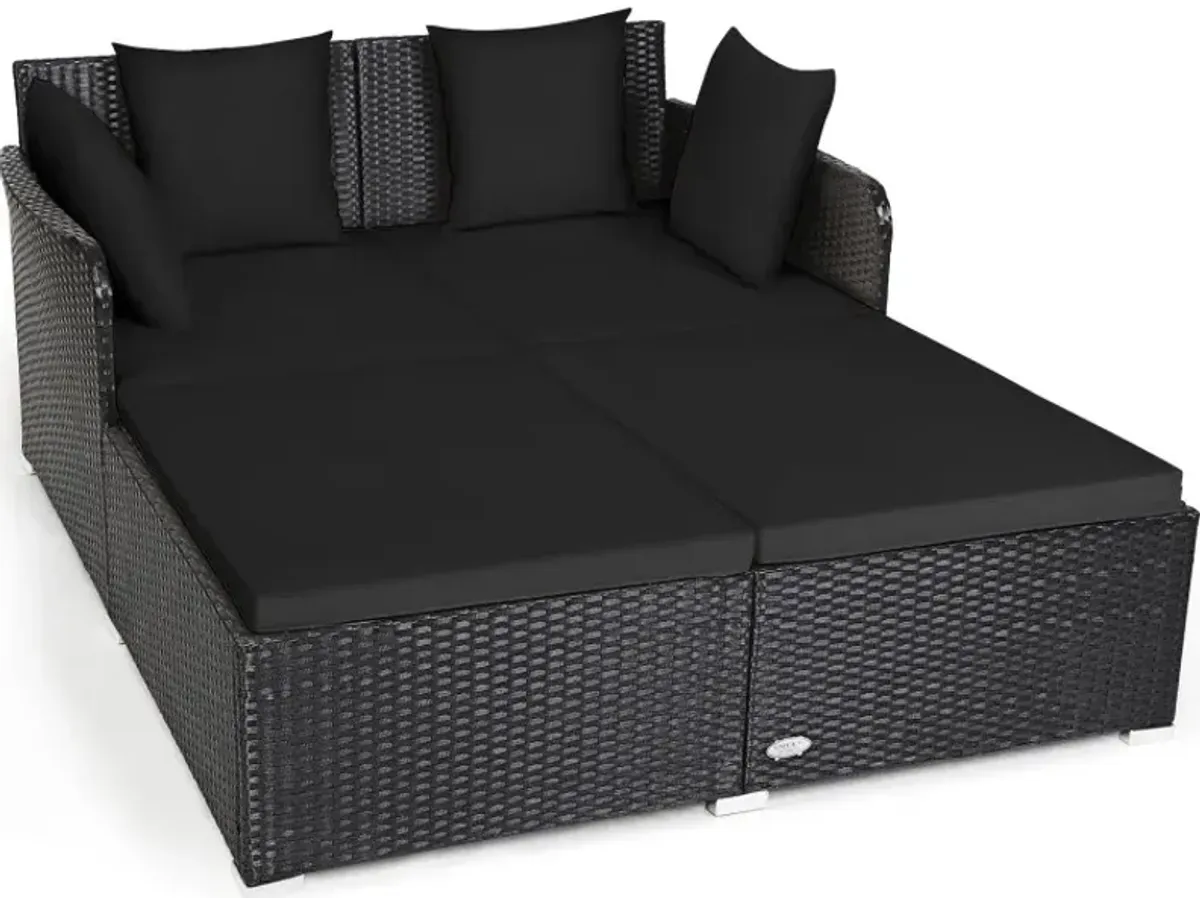 Spacious Outdoor Rattan Daybed with Upholstered Cushions and Pillows