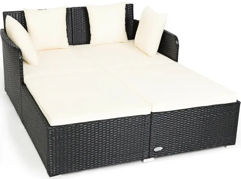 Spacious Outdoor Rattan Daybed with Upholstered Cushions and Pillows