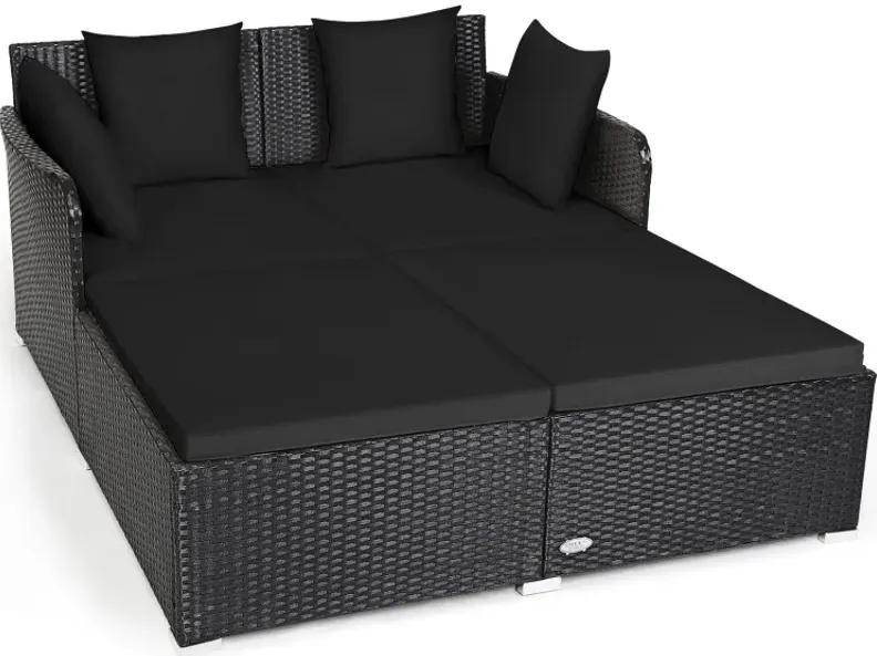 Spacious Outdoor Rattan Daybed with Upholstered Cushions and Pillows