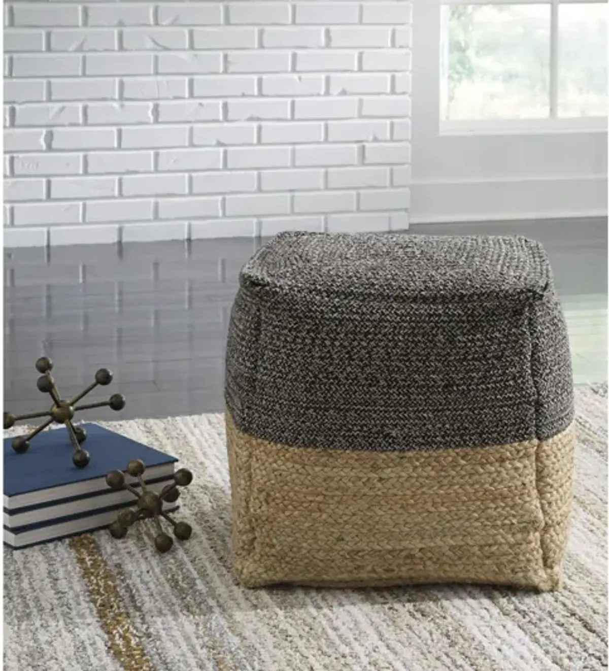 Sweed Natural and Black Valley Pouf by Ashley