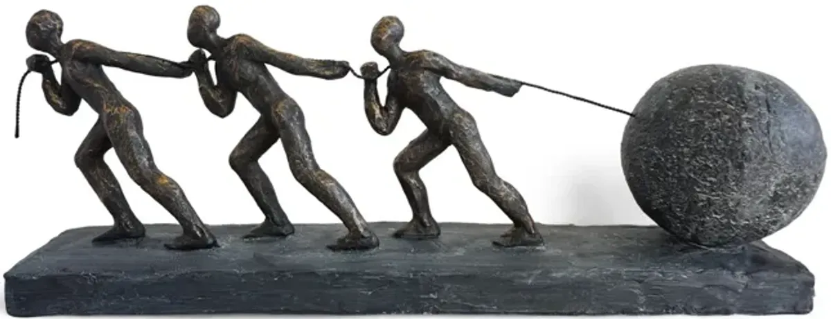 Men Pulling Rock Sculpture