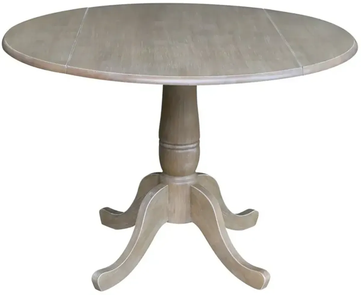 DINING ESSENTIALS 42 INCH DROP LEAF TABLE TOP WITH 30 INCH TRADITIONAL PEDESTAL BASE IN TAUPE GRAY