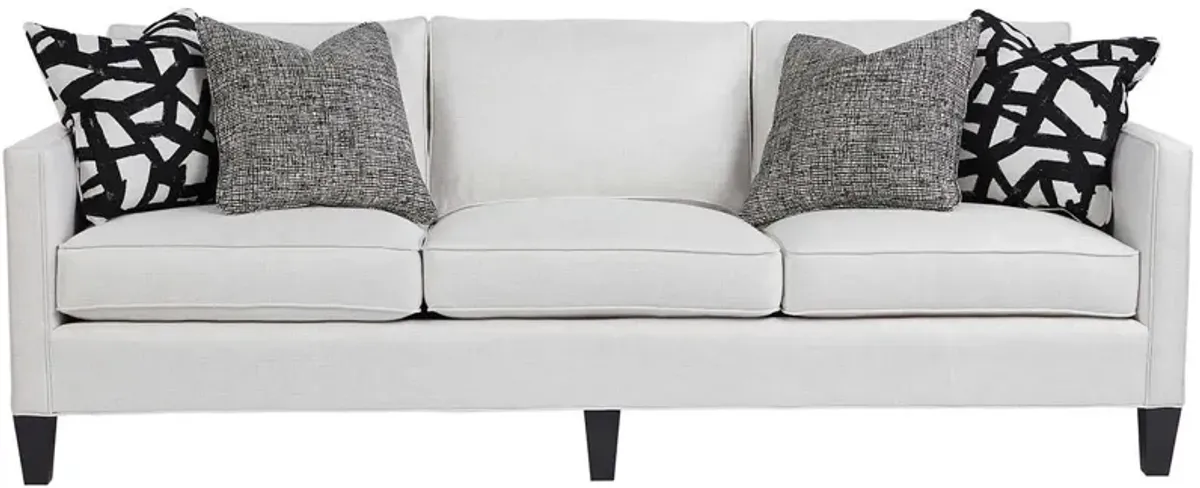 Universal Harrison Modern Sofa Body in Carolina Ivory Pillows in Juno Black & Paxton Classic Onyx Leg Finish Standard Uniblend Seat Cushion Cores