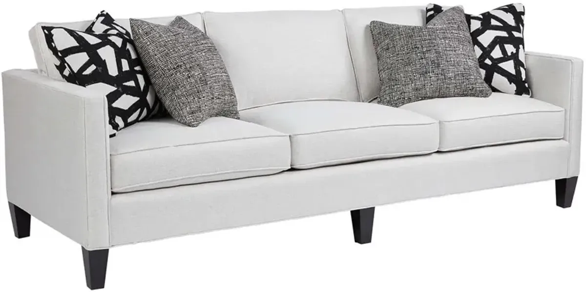 Universal Harrison Modern Sofa Body in Carolina Ivory Pillows in Juno Black & Paxton Classic Onyx Leg Finish Standard Uniblend Seat Cushion Cores