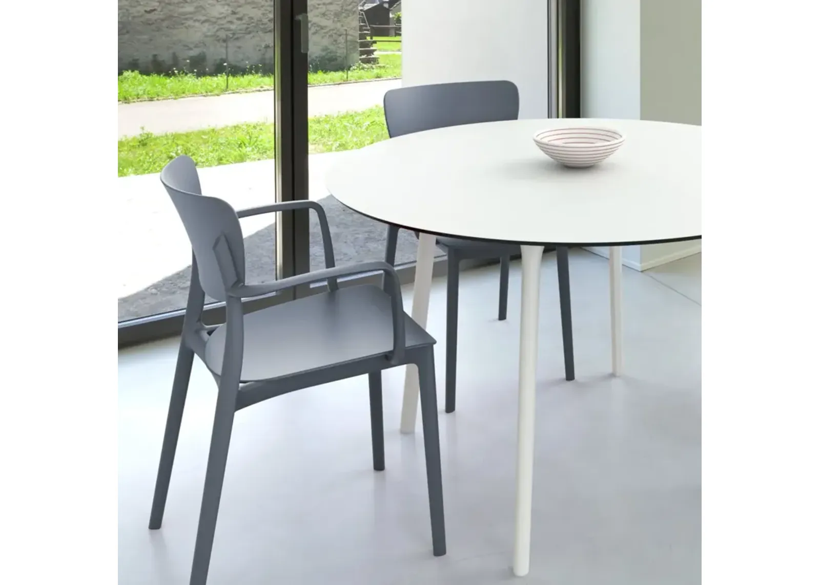 Compamia 47 Inch Lisa Round Outdoor Dining Set with White Table & Dark Gray Armchairs