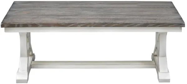 LANDINGS COCKTAIL COFFEE TABLE WITH PLANK STYLE TOP AND TRESTLE BASE