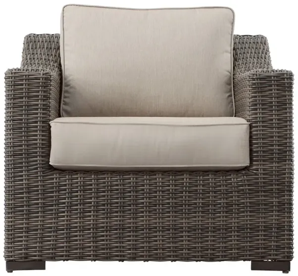 JONES LOUNGE CHAIR WITH HALF-ROUND RESIN WICKER