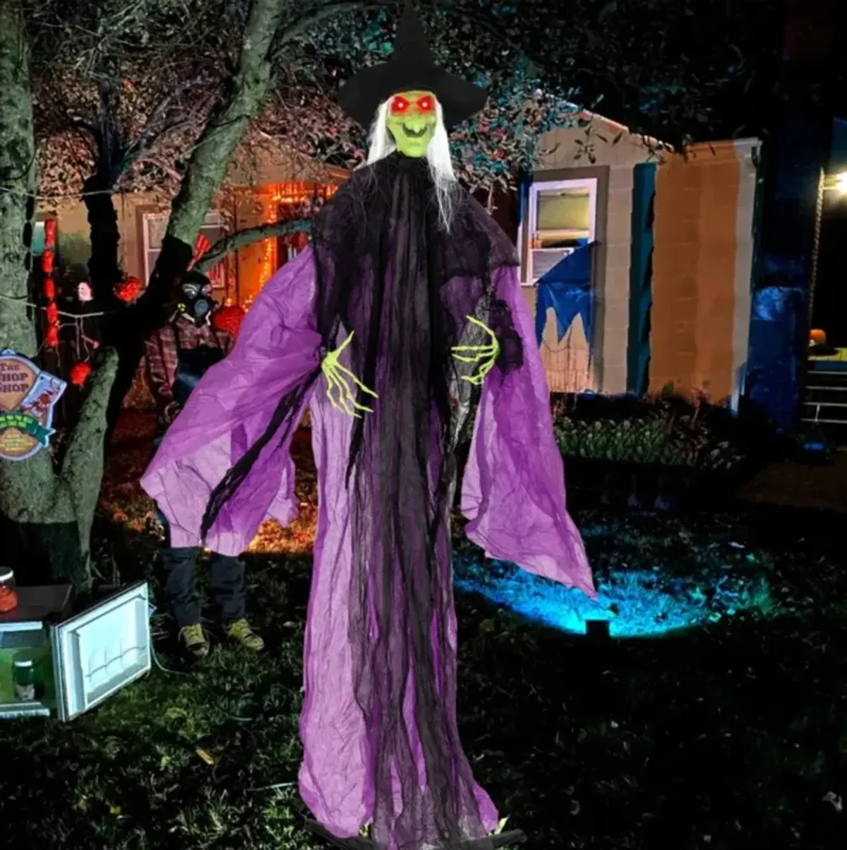 Hivvago 7.2 ft Halloween Standing Witch with Lighted Eyes and Automatic Arm Movement