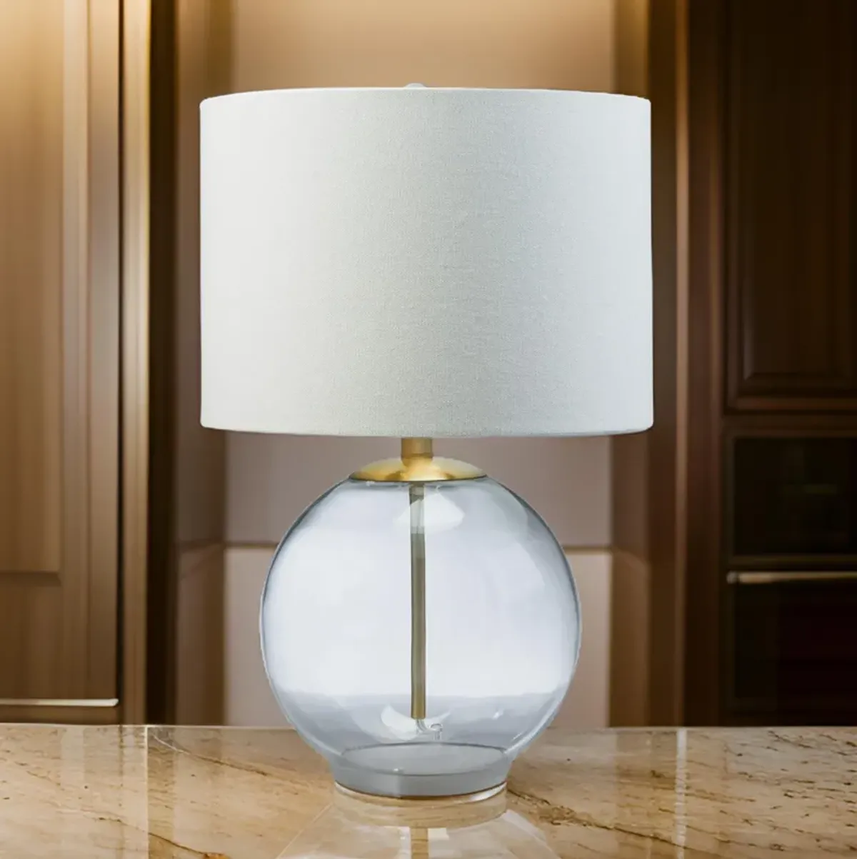 21 Inch Table Lamp, White Drum Shade, Round Clear Glass Base, Brass Metal - Benzara