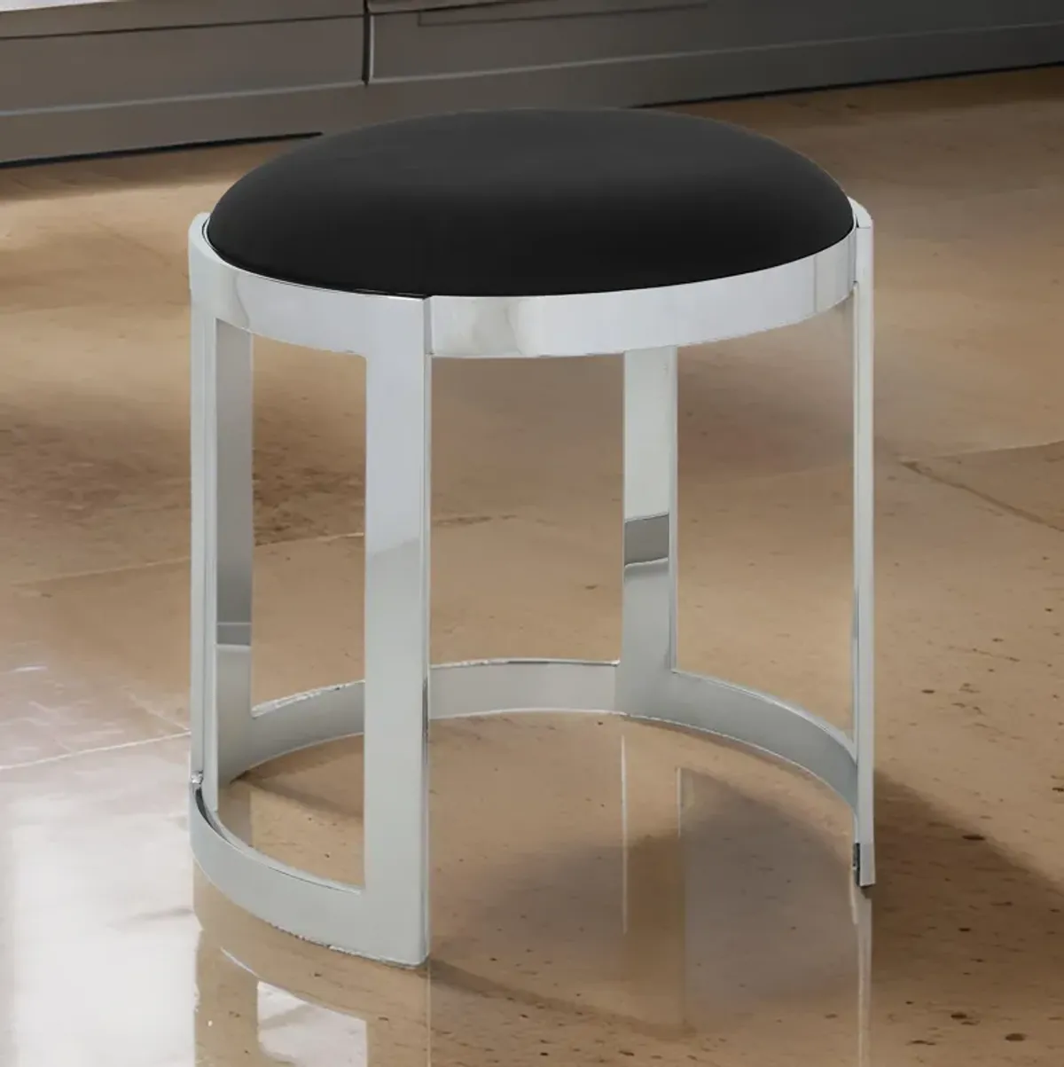 Niyo 19 Inch Accent Stool Ottoman Ottoman, Round Black Faux Leather, Silver - Benzara