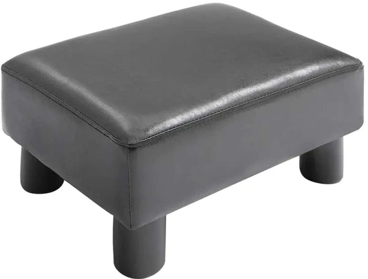 HOMCOM Ottoman Foot Rest, Small Foot Stool with Faux Leather Upholstery, Rectangular Ottoman Footrest with Padded Foam Seat and Plastic Legs, Bright Black