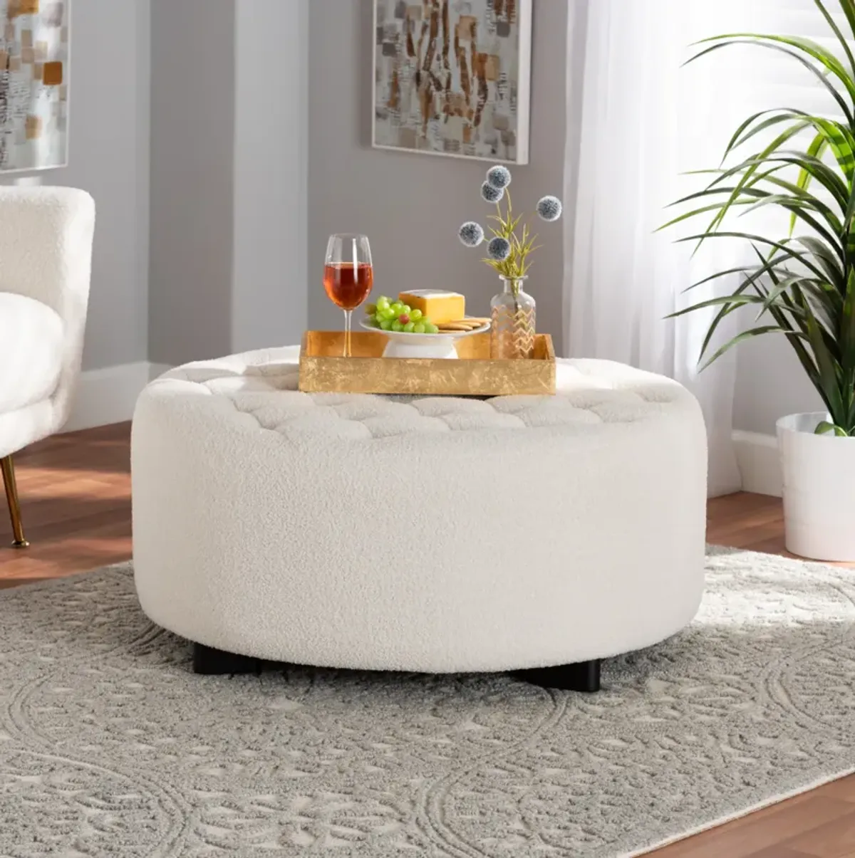 Baxton Studio Athena Modern and Ivory Boucle Upholstered and Black Finished Round Ottoman