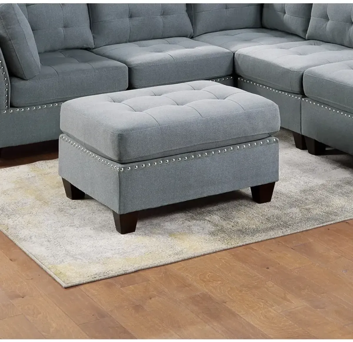 Grey Tufted Ottoman with Nailhead Trim and Wooden Legs