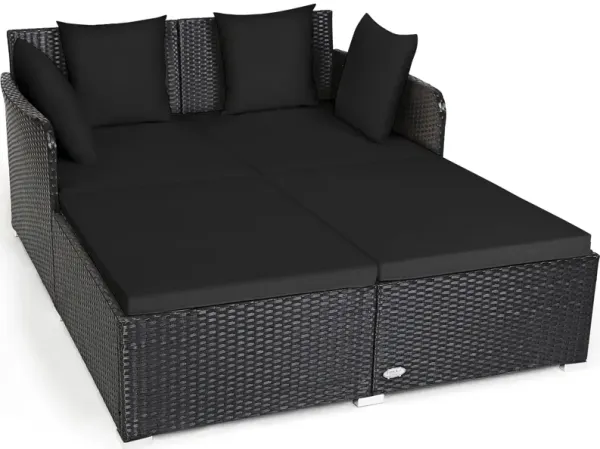 Outdoor Woven Rattan Daybed with Deep Cushions and Multiple Pillows