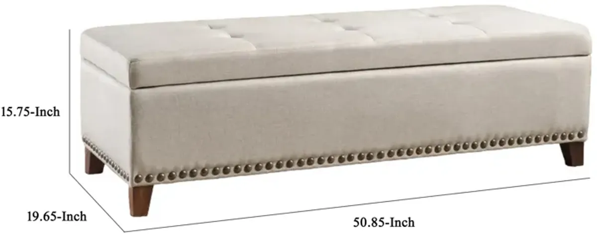 Nancy Storage Ottoman Bench, 51 Inch Beige Fabric, Brass Nailhead Trim - Benzara