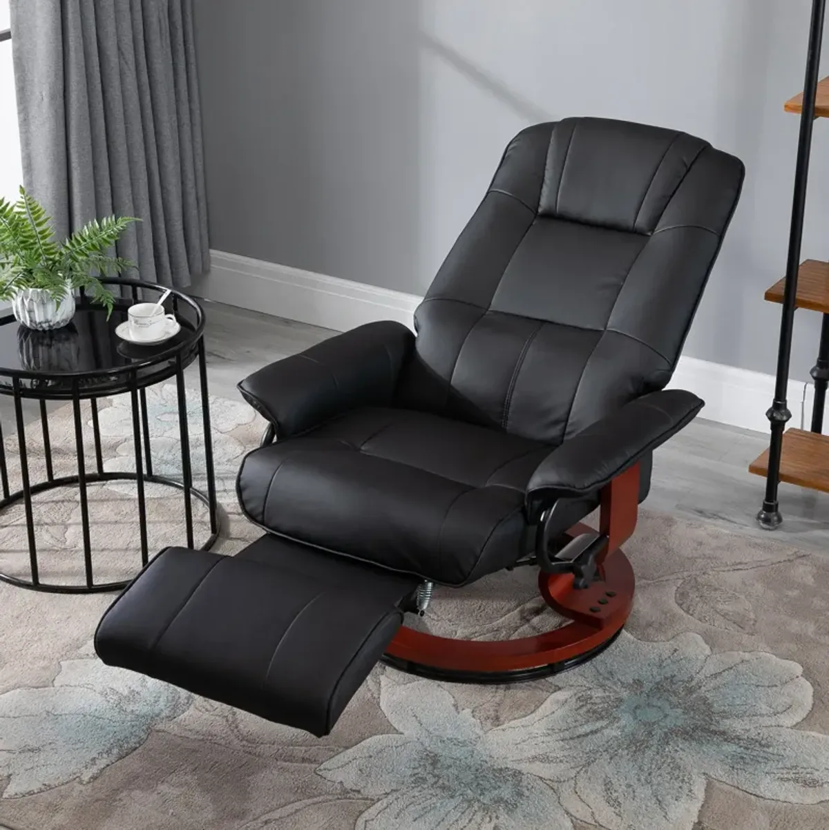 Black Leather Lounger: Swivel Recliner with Adjustable Footrest