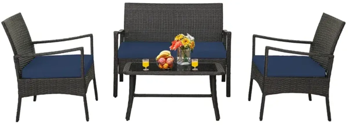 4 Pieces Outdoor Rattan Conversation Set with Tempered Glass Coffee Table