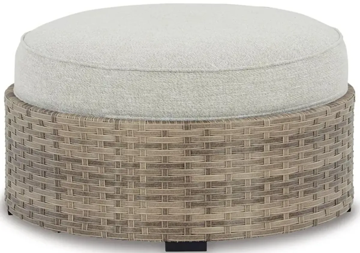 Walter 35 Inch Outdoor Ottoman with Round Cushion Top, Resin Wicker, Beige - Benzara