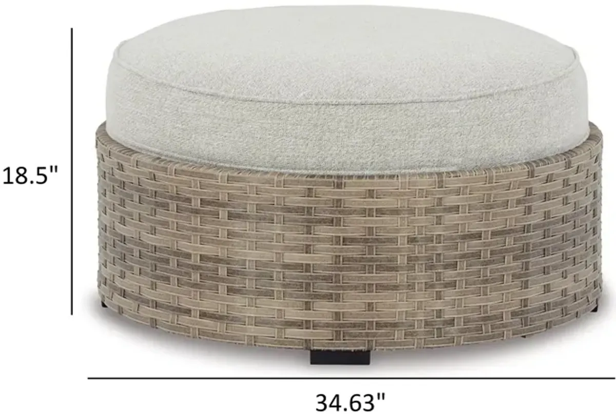 Walter 35 Inch Outdoor Ottoman with Round Cushion Top, Resin Wicker, Beige - Benzara