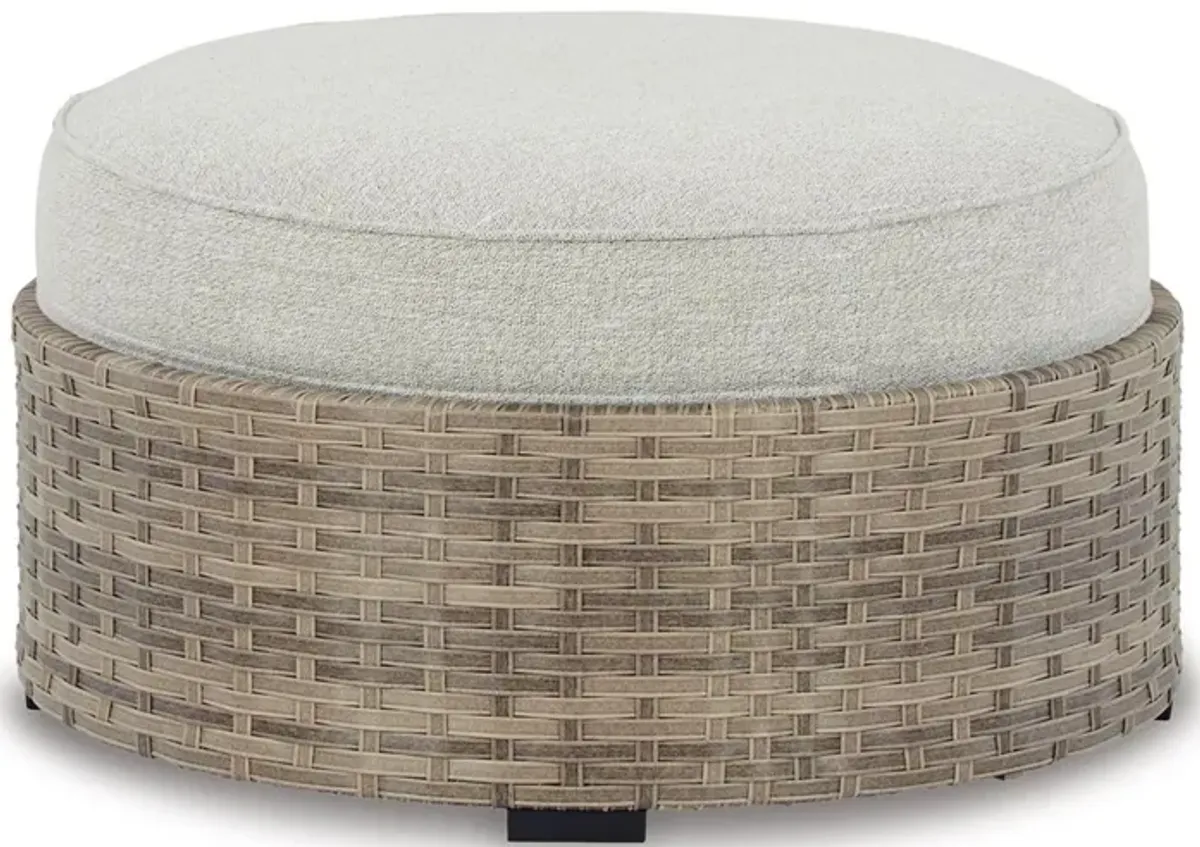 Walter 35 Inch Outdoor Ottoman with Round Cushion Top, Resin Wicker, Beige - Benzara