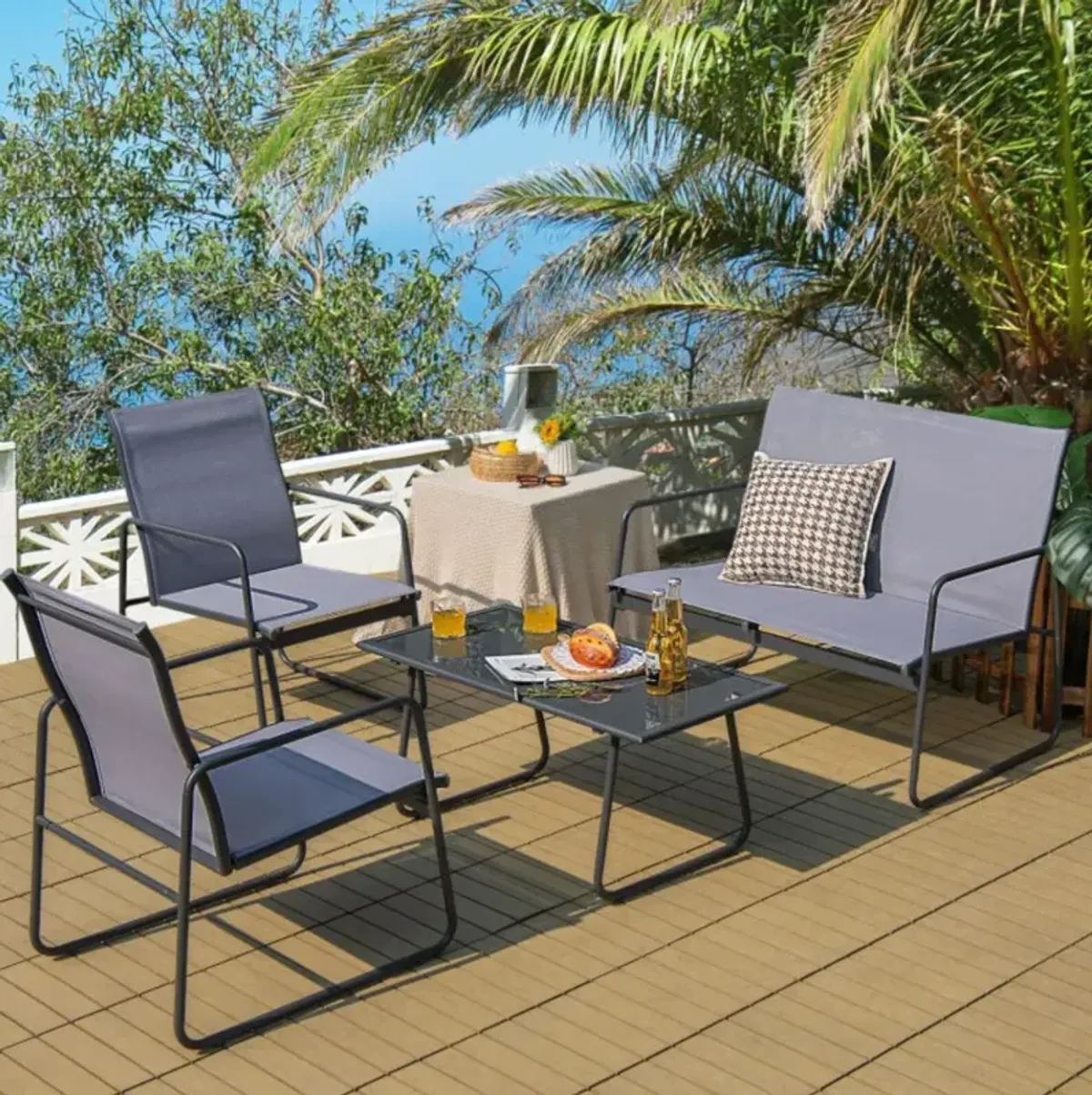 Hivvago 4 Pieces of Metal Patio Furniture Chat Set with Tempered Glass Coffee Table