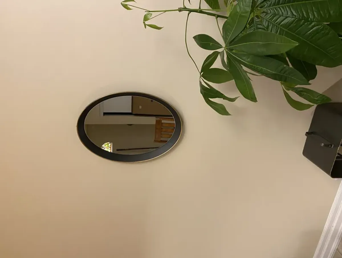 Oval metal decorative mirror