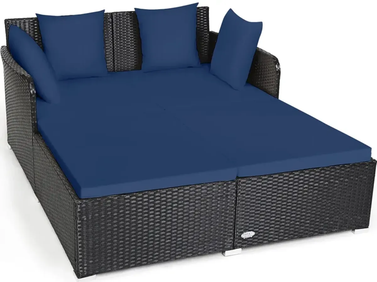 Spacious Outdoor Rattan Daybed with Upholstered Cushions and Pillows