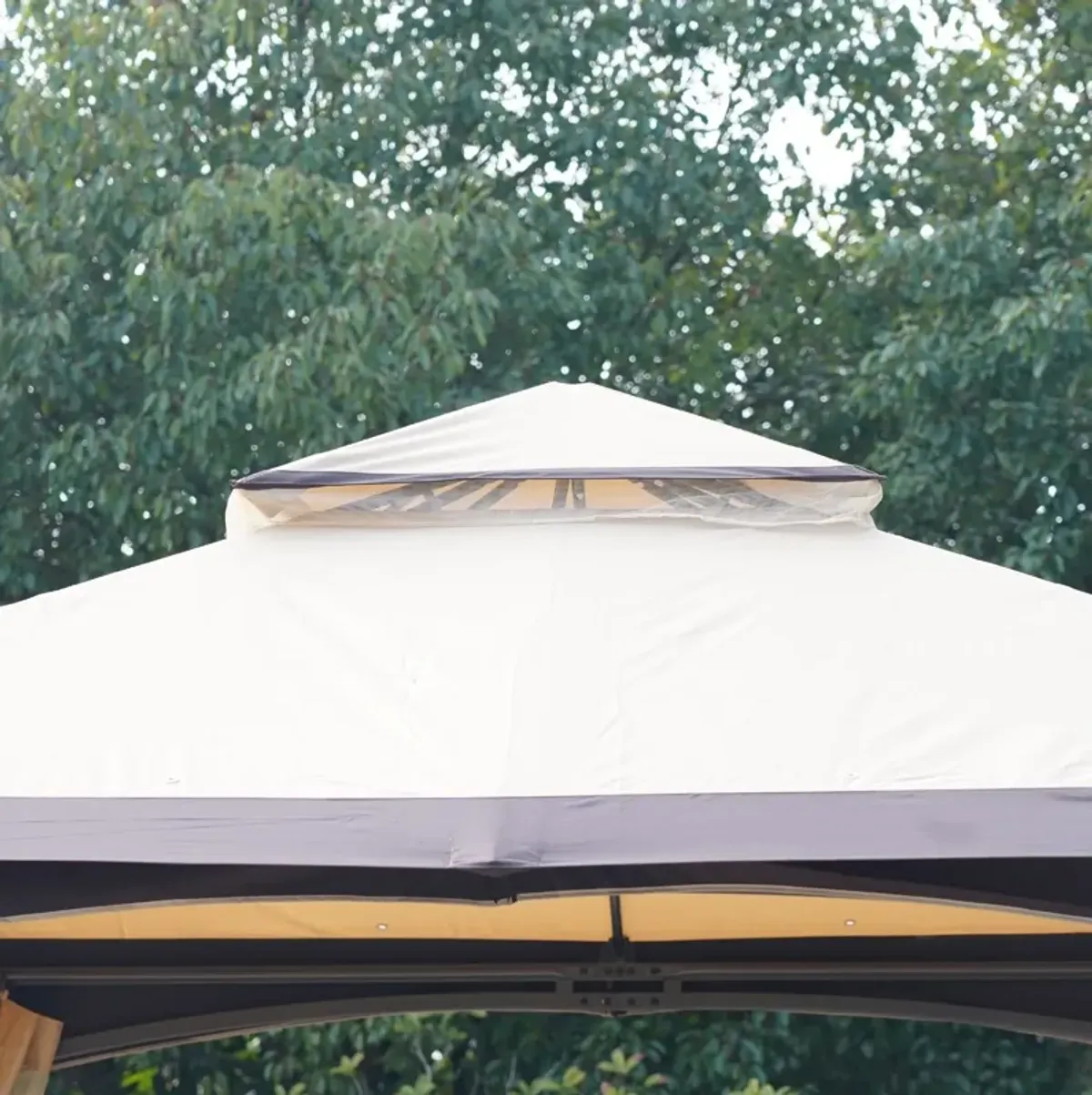 Shaded Outdoor Oasis: 10'x10' Gazebo with Netting and 2-Tier Soft Top