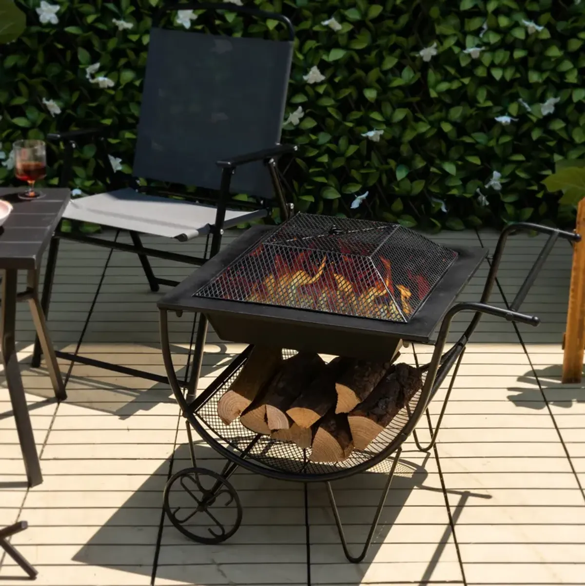 Outdoor Wood Burning Fire Pit with Log Storage Rack and Wheels