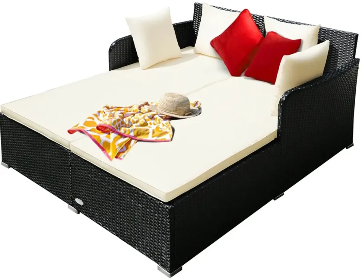 Spacious Outdoor Rattan Daybed with Upholstered Cushions and Pillows