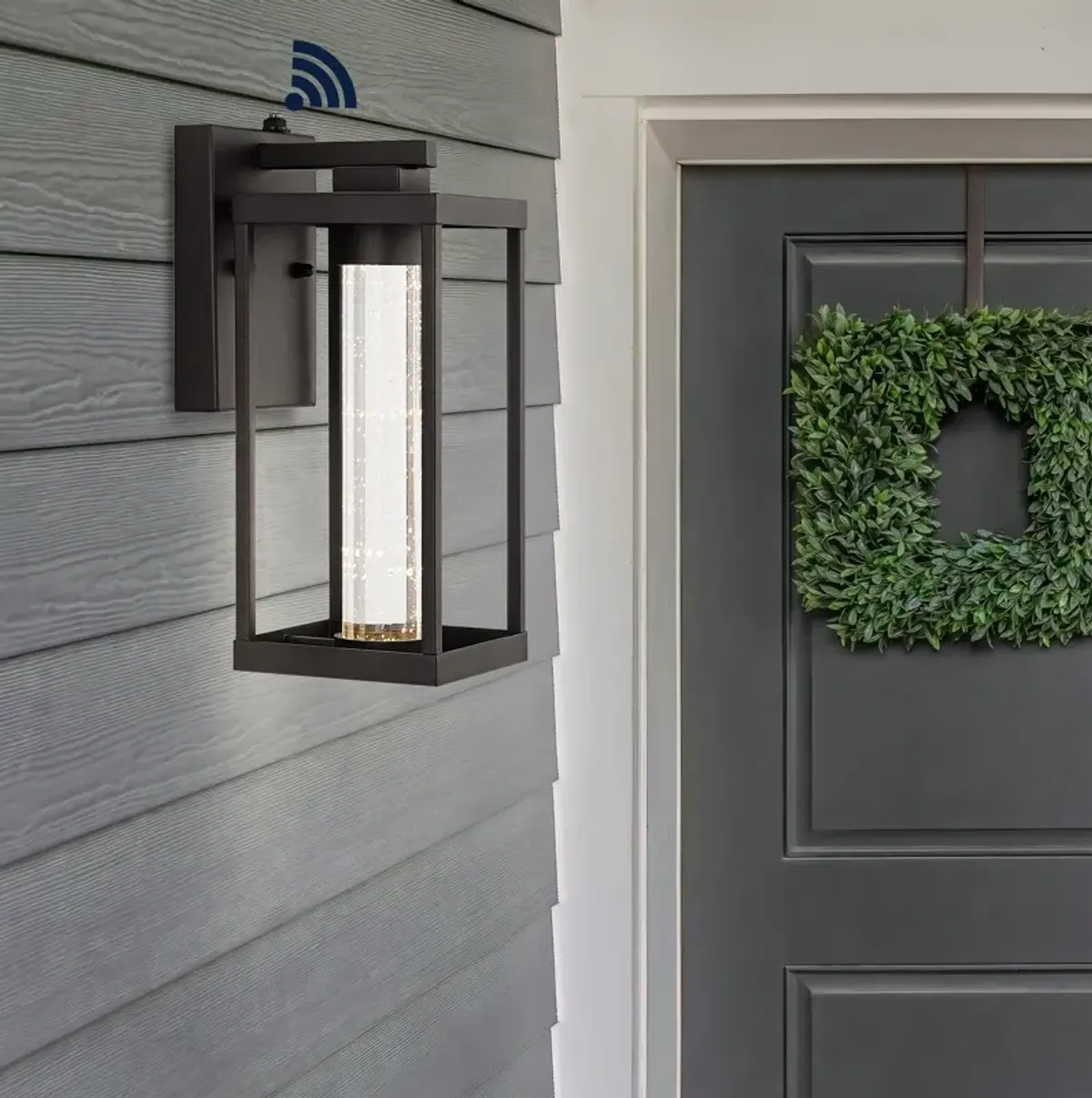 Juno 1-Light Industrial Vintage Iron/Seeded Glass with Dusk-to-Dawn Sensor Integrated LED Outdoor Sconce