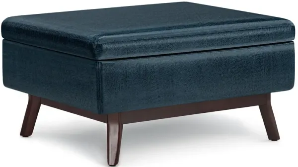 Owen Coffee Table Storage Ottoman in Distressed Dark Blue Faux Leather