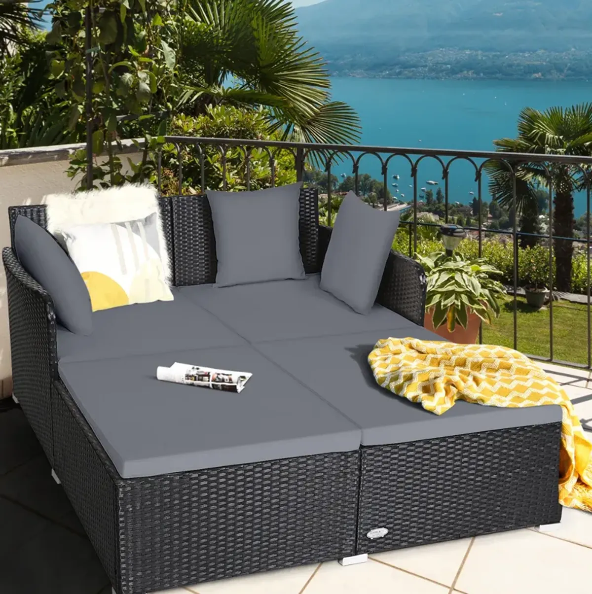 Spacious Outdoor Rattan Daybed with Upholstered Cushions and Pillows