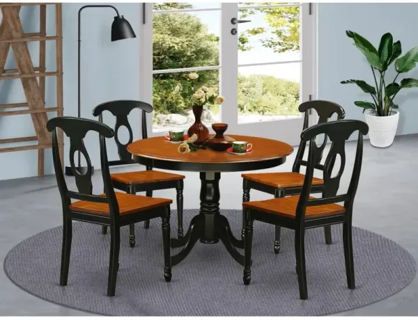 5 Pc set with a Round Dinette Table and 4 Leather Kitchen Chairs in Black and Cherry .