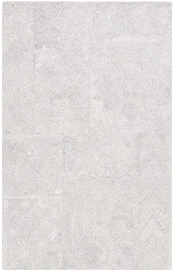 ABSTRACT Hand Tufted 5' x 8' area rug