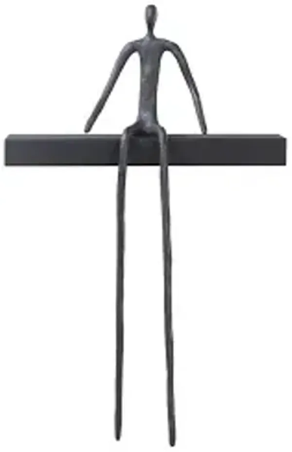 moveable man on short shelf , sitting, a