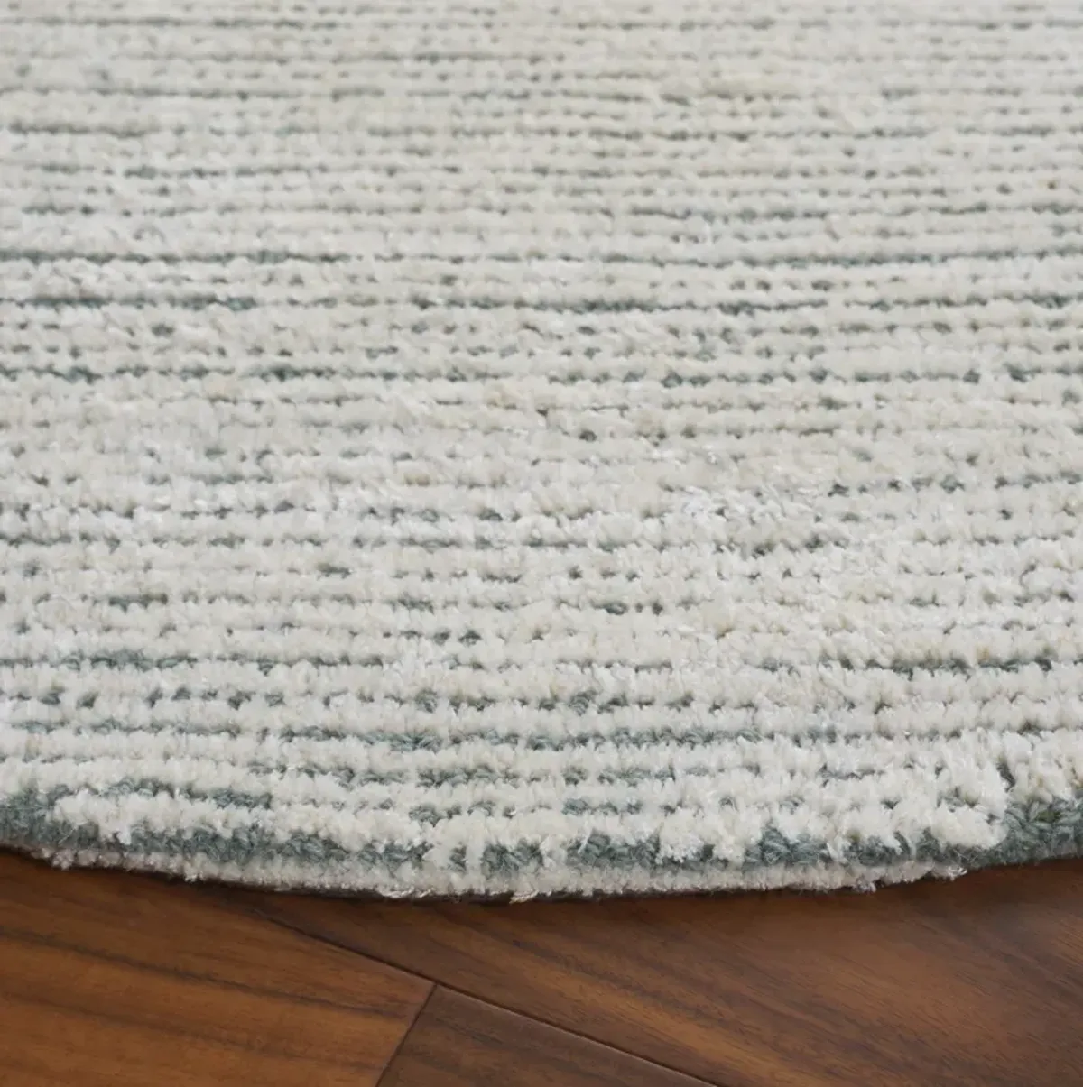 MIRAGE Hand Tufted 6' x 6' Round area rug