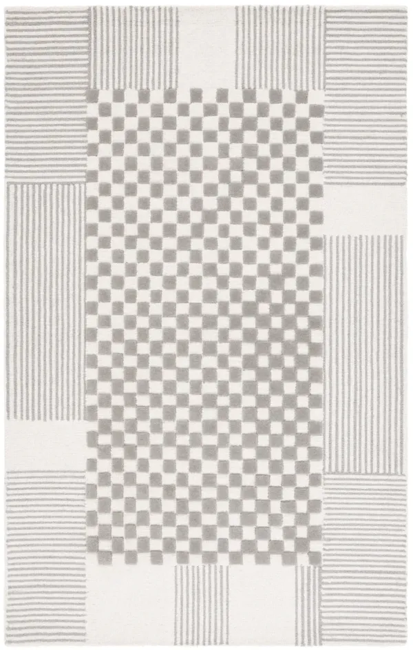 GENRE Hand Tufted 4' x 6' area rug