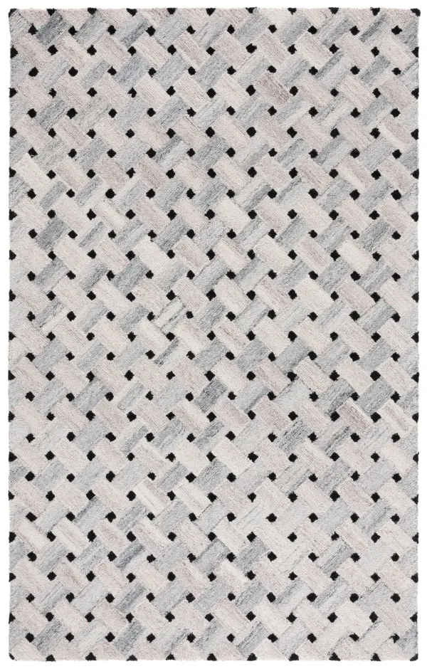 GENRE Hand Tufted 5' x 8' area rug