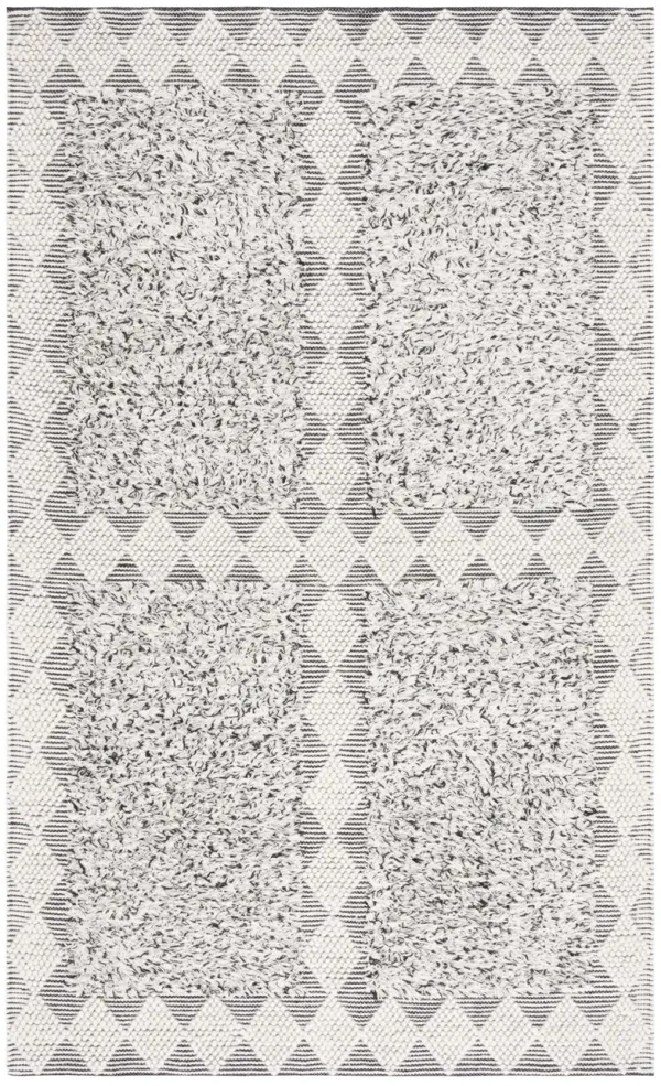 NATURA Hand Loomed 5' x 8' area rug