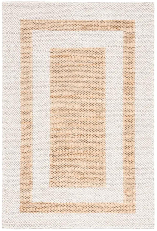 NATURA Hand loomed 5' x 8' area rug