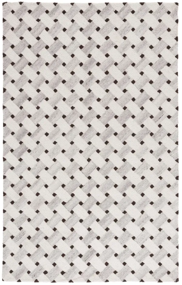 GENRE Hand Tufted 3' x 5' area rug