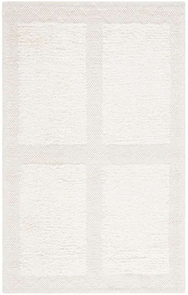 NATURA Hand Loomed 5' x 8' area rug