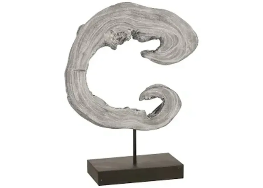 creature sculpture on stand, gray stone